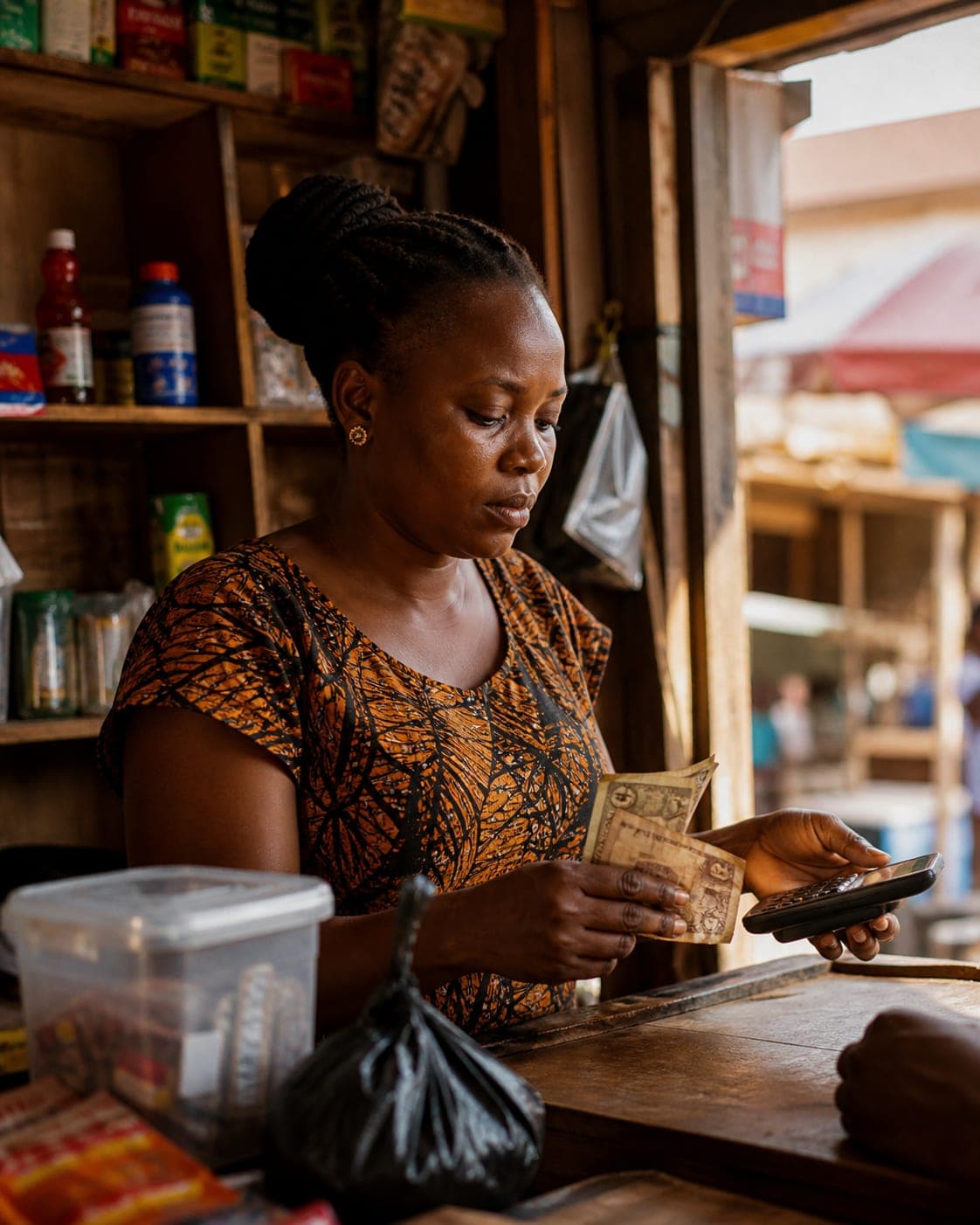 An agent completing a cash withdrawal for a customer at her counter